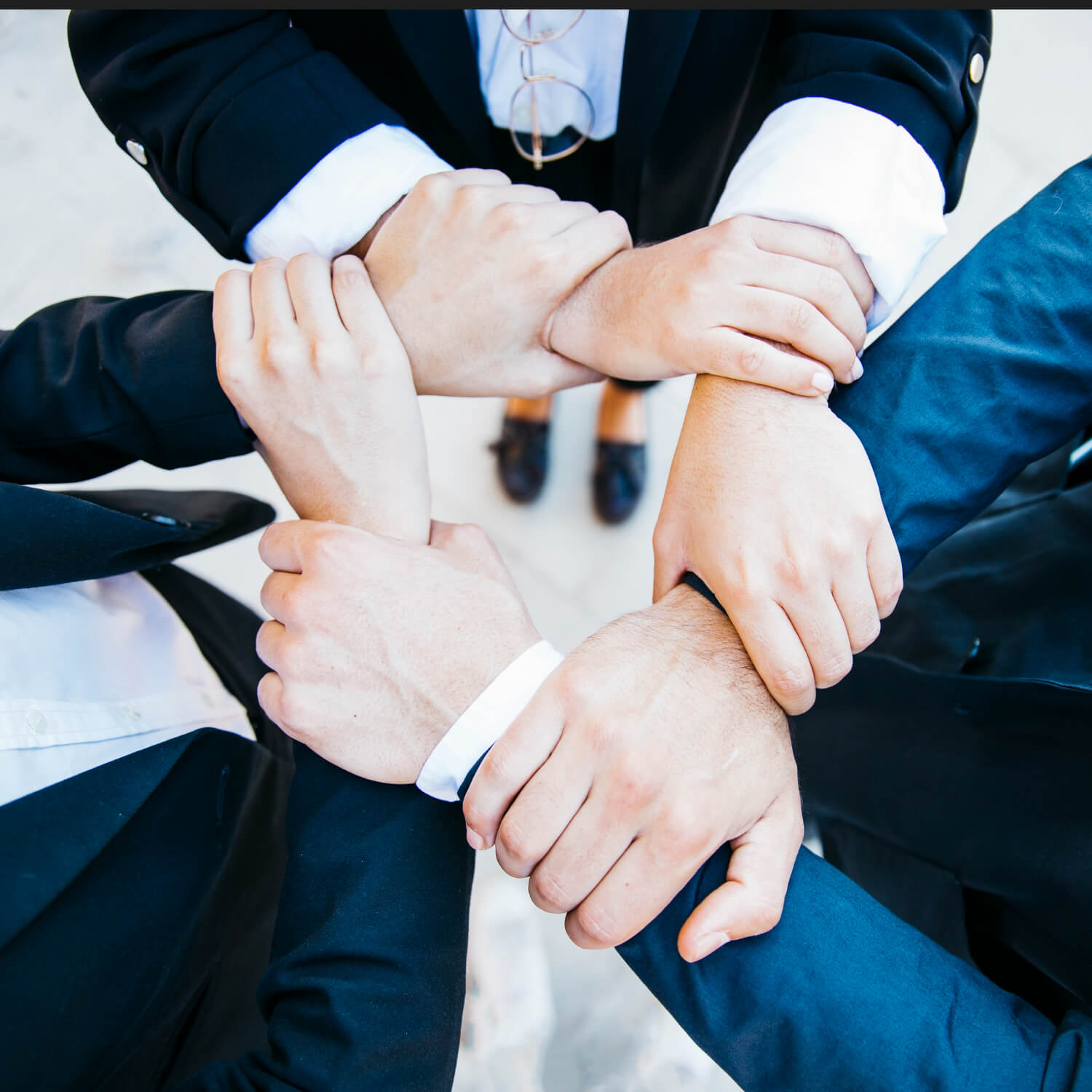 Team putting hands together